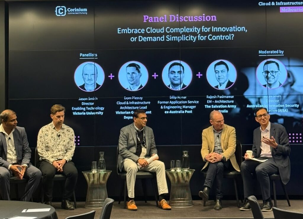 Corinium Cloud and Infrastructure Summit Rajiv moderating a panel discussion at a conference